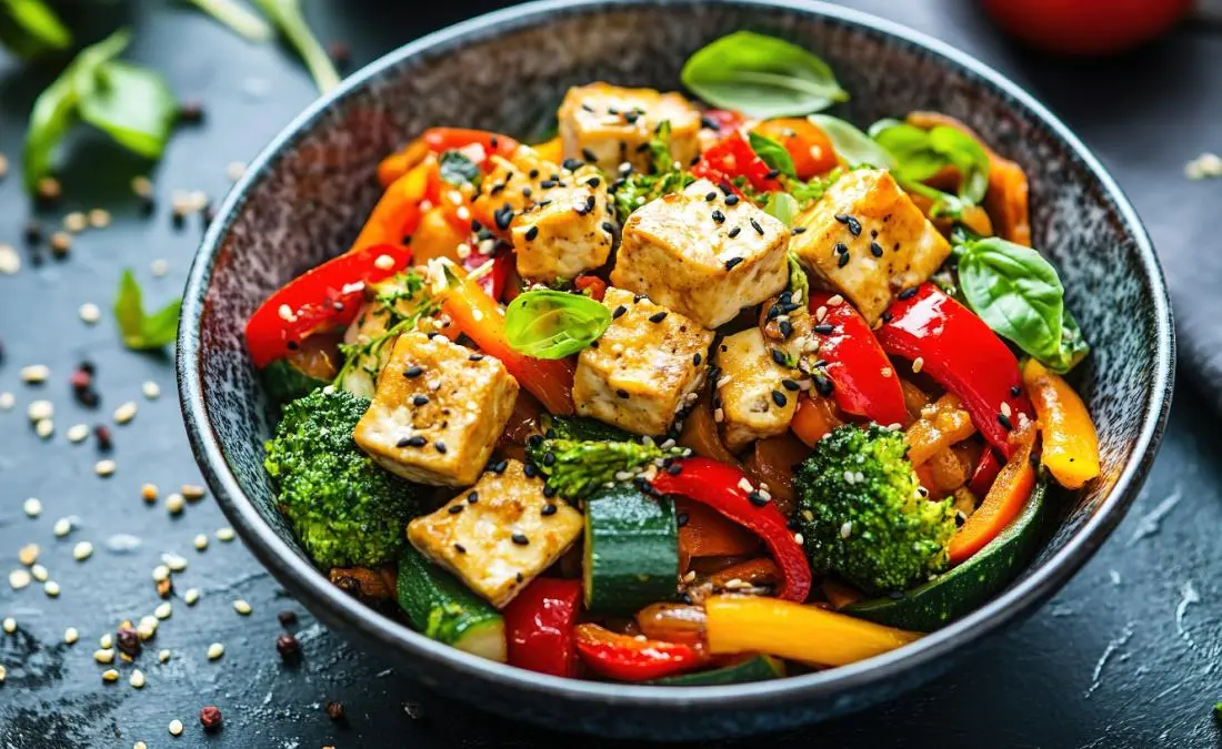 Grilled tofu with broccoli, bell peppers, carrots, and zucchini